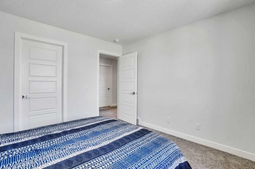 183 Brander Avenue, Langdon, AB - Indoor Photo Showing Bedroom