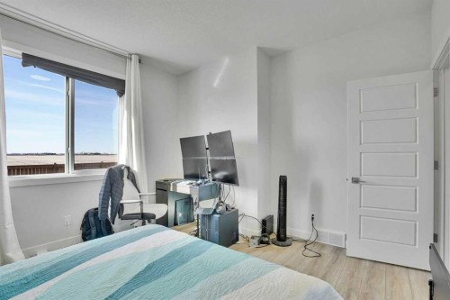 183 Brander Avenue, Langdon, AB - Indoor Photo Showing Bedroom