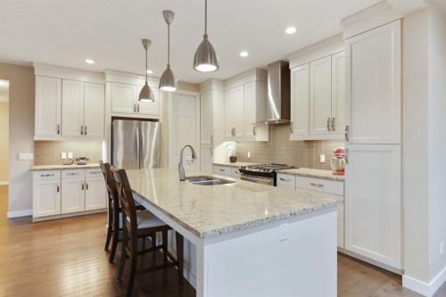 33 Quarry Heights Se, Calgary, AB - Indoor Photo Showing Kitchen With Stainless Steel Kitchen With Double Sink With Upgraded Kitchen