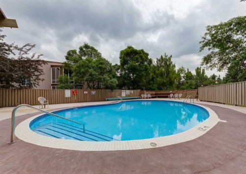 492-8948 Elbow Drive Sw, Calgary, AB - Outdoor With In Ground Pool With Backyard