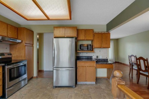 212 Westwood Drive Sw, Calgary, AB - Indoor Photo Showing Kitchen With Stainless Steel Kitchen