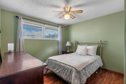 212 Westwood Drive Sw, Calgary, AB - Indoor Photo Showing Bedroom