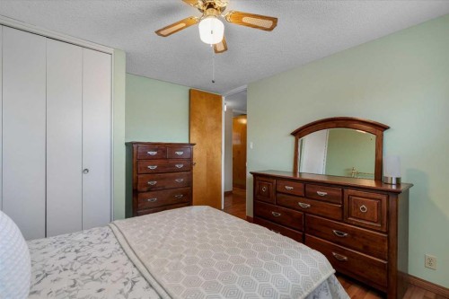 212 Westwood Drive Sw, Calgary, AB - Indoor Photo Showing Bedroom