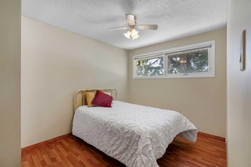 212 Westwood Drive Sw, Calgary, AB - Indoor Photo Showing Bedroom