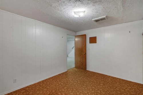 212 Westwood Drive Sw, Calgary, AB - Indoor Photo Showing Other Room