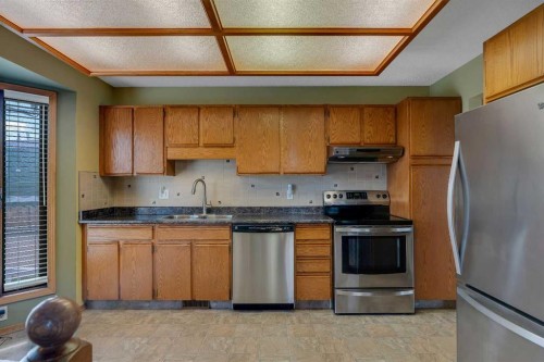 212 Westwood Drive Sw, Calgary, AB - Indoor Photo Showing Kitchen With Stainless Steel Kitchen