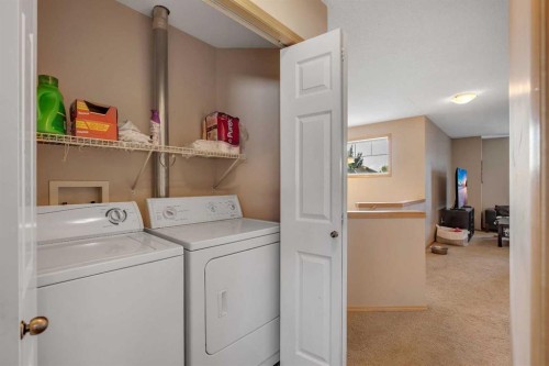 100 Covecreek Close Ne, Calgary, AB - Indoor Photo Showing Laundry Room