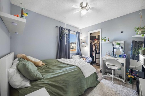 67 Evansmeade Crescent Nw, Calgary, AB - Indoor Photo Showing Bedroom