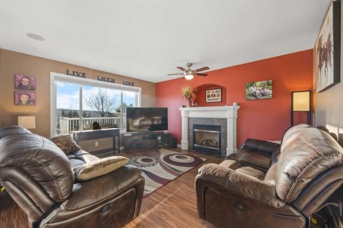 67 Evansmeade Crescent Nw, Calgary, AB - Indoor Photo Showing Living Room With Fireplace