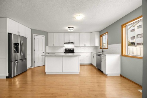 36 Arbour Wood Crescent Nw, Calgary, AB - Indoor Photo Showing Kitchen With Stainless Steel Kitchen With Upgraded Kitchen