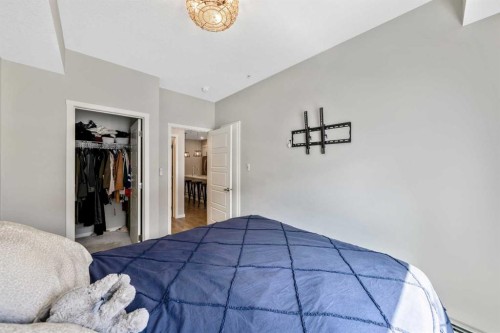 117-4150 Seton Drive Se, Calgary, AB - Indoor Photo Showing Bedroom