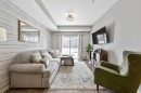 117-4150 Seton Drive Se, Calgary, AB  - Indoor Photo Showing Living Room 