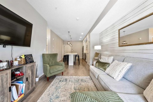 117-4150 Seton Drive Se, Calgary, AB - Indoor Photo Showing Living Room