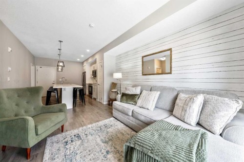 117-4150 Seton Drive Se, Calgary, AB - Indoor Photo Showing Living Room
