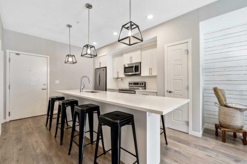 117-4150 Seton Drive Se, Calgary, AB - Indoor Photo Showing Kitchen With Upgraded Kitchen