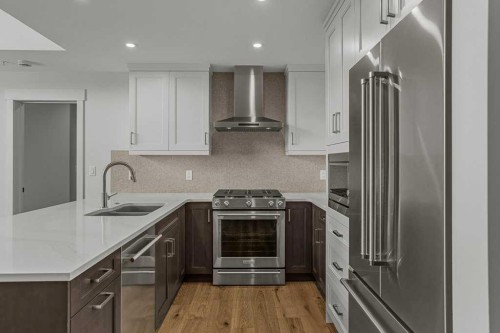 401-1505 Spring Creek Gate, Canmore, AB - Indoor Photo Showing Kitchen With Double Sink With Upgraded Kitchen