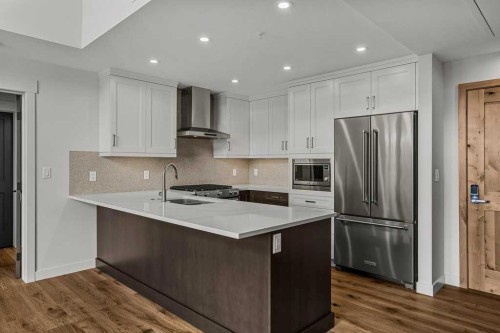 401-1505 Spring Creek Gate, Canmore, AB - Indoor Photo Showing Kitchen With Double Sink With Upgraded Kitchen