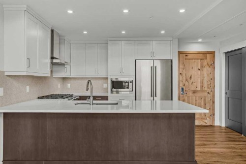 401-1505 Spring Creek Gate, Canmore, AB - Indoor Photo Showing Kitchen With Upgraded Kitchen