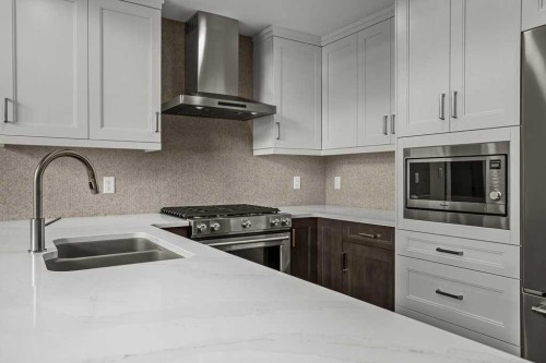 401-1505 Spring Creek Gate, Canmore, AB - Indoor Photo Showing Kitchen With Double Sink With Upgraded Kitchen