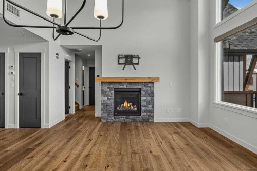 401-1505 Spring Creek Gate, Canmore, AB - Indoor Photo Showing Living Room With Fireplace