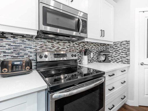 608 Evansborough Way Nw, Calgary, AB - Indoor Photo Showing Kitchen With Upgraded Kitchen