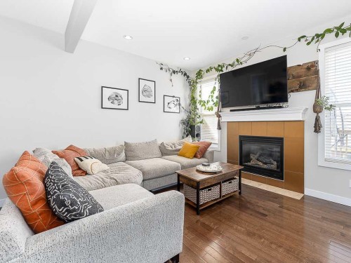 608 Evansborough Way Nw, Calgary, AB - Indoor Photo Showing Living Room With Fireplace