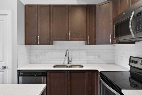 12 Evanscrest Gardens Nw, Calgary, AB - Indoor Photo Showing Kitchen With Double Sink
