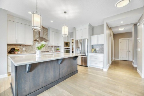 143 Stonemere Green, Chestermere, AB - Indoor Photo Showing Kitchen With Stainless Steel Kitchen With Upgraded Kitchen