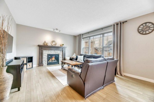 143 Stonemere Green, Chestermere, AB - Indoor Photo Showing Living Room With Fireplace