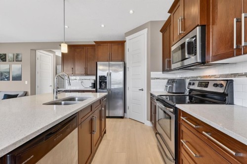 1612 Monteith Drive Se, High River, AB - Indoor Photo Showing Kitchen With Double Sink With Upgraded Kitchen