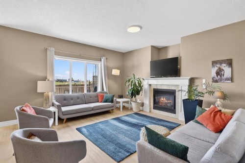 1612 Monteith Drive Se, High River, AB - Indoor Photo Showing Living Room With Fireplace