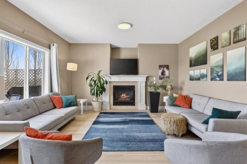 1612 Monteith Drive Se, High River, AB - Indoor Photo Showing Living Room With Fireplace