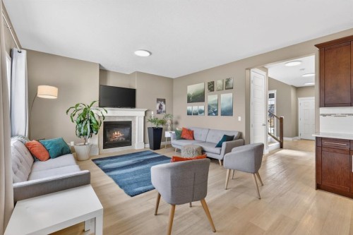 1612 Monteith Drive Se, High River, AB - Indoor Photo Showing Living Room With Fireplace