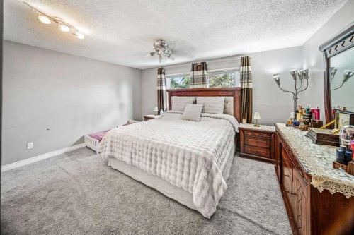 96 Mckinley Road Se, Calgary, AB - Indoor Photo Showing Bedroom