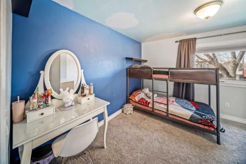 96 Mckinley Road Se, Calgary, AB - Indoor Photo Showing Bedroom