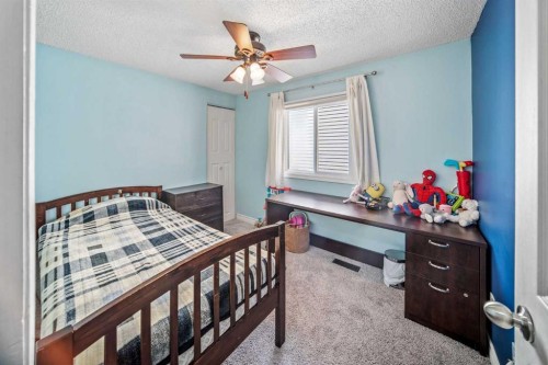 96 Mckinley Road Se, Calgary, AB - Indoor Photo Showing Bedroom