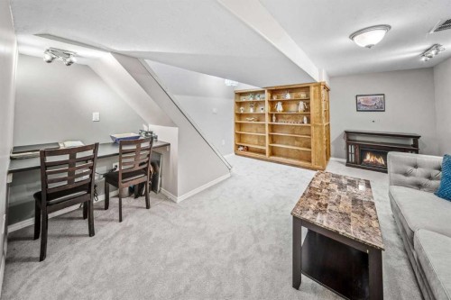 96 Mckinley Road Se, Calgary, AB - Indoor With Fireplace