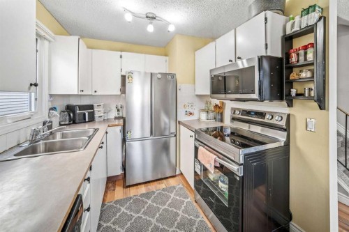 96 Mckinley Road Se, Calgary, AB - Indoor Photo Showing Kitchen With Stainless Steel Kitchen With Double Sink