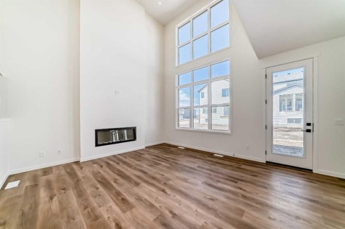 61 Bartlett Way Se, Calgary, AB - Indoor Photo Showing Other Room With Fireplace