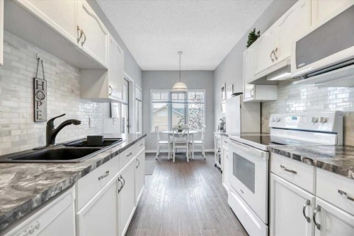 35-72 Millside Drive Sw, Calgary, AB - Indoor Photo Showing Kitchen With Double Sink