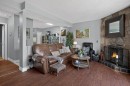23-643 4 Avenue Ne, Calgary, AB  - Indoor Photo Showing Living Room With Fireplace 