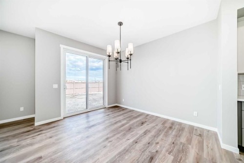 130 Bartlett Row Se, Calgary, AB - Indoor Photo Showing Other Room With Fireplace