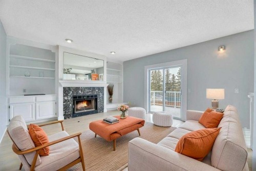 215 Hawktree Circle Nw, Calgary, AB - Indoor Photo Showing Living Room With Fireplace