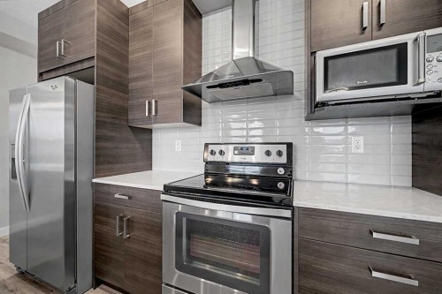 304-10 Walgrove Walk Se, Calgary, AB - Indoor Photo Showing Kitchen With Upgraded Kitchen