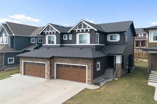 239 Kinniburgh Road, Chestermere, AB - Outdoor With Facade