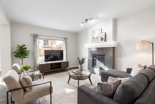 239 Kinniburgh Road, Chestermere, AB - Indoor Photo Showing Living Room With Fireplace