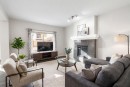 239 Kinniburgh Road, Chestermere, AB  - Indoor Photo Showing Living Room With Fireplace 
