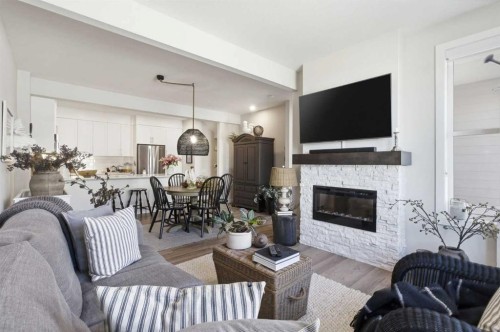 307 Crestridge Common Sw, Calgary, AB - Indoor Photo Showing Living Room With Fireplace