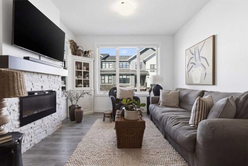 307 Crestridge Common Sw, Calgary, AB - Indoor Photo Showing Living Room With Fireplace