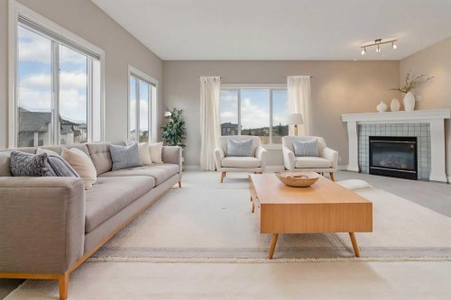 357 Kincora Drive Nw, Calgary, AB - Indoor Photo Showing Living Room With Fireplace